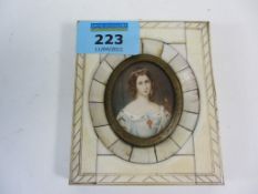 Late 19th/early20th century oval portrait miniature of a lady in light blue dress 4.5cm