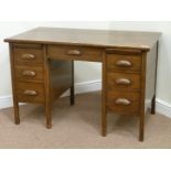 Early 20th century vintage oak twin pedestal desk fitted with seven drawers,