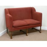 Oak framed two seat wing back sofa upholstered in red cover,