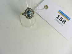 Topaz and diamond cluster ring hallmarked 9ct