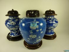 Pair of Chinese 19th/20th Century blue and white baluster jars printed with prunus blossom 21cm