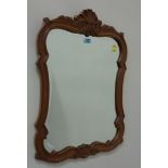 Bevelled edge mirror in carved wood frame H76cm