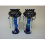 Pair of blue glass lustres with enamel decoration and clear cut crystal pendants 29cm