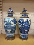 Pair of late 19th century Chinese crackleware vases and covers,
