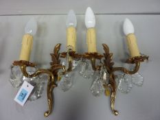 Pair French brass two branch wall sconces hung with crystal drops