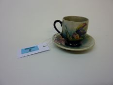 William Moorcroft coffee cup and saucer - orchid pattern