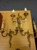 Pair of French Rococo design brass two branch wall sconces and one other similar (3)