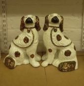 Pair Staffordshire spaniels with copper lustre  H10.9cm  Condition Report good condition