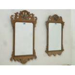 Reproduction walnut Chippendale style fret work mirror, with feathers motif (49cm x 85cm),