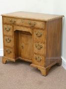 Early 20th century George II style walnut kneehole desk,