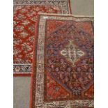 Persian red ground rug (170cm x 105cm),
