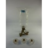 Early 20th century candle stand with etched glass shade H39cm and a trio of candlesticks