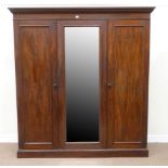 Early 19th century mahogany triple wardrobe, double fitted interior with linen trays and drawers,