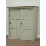 Painted pine kitchen cupboard enclosed by two sliding doors, W127cm,