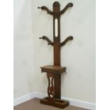 Early 20th century mahogany coat stand fitted with mirror and compartment,