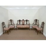 Edwardian mahogany framed salon suite with carved detail, upholstered in red stripe fabric,