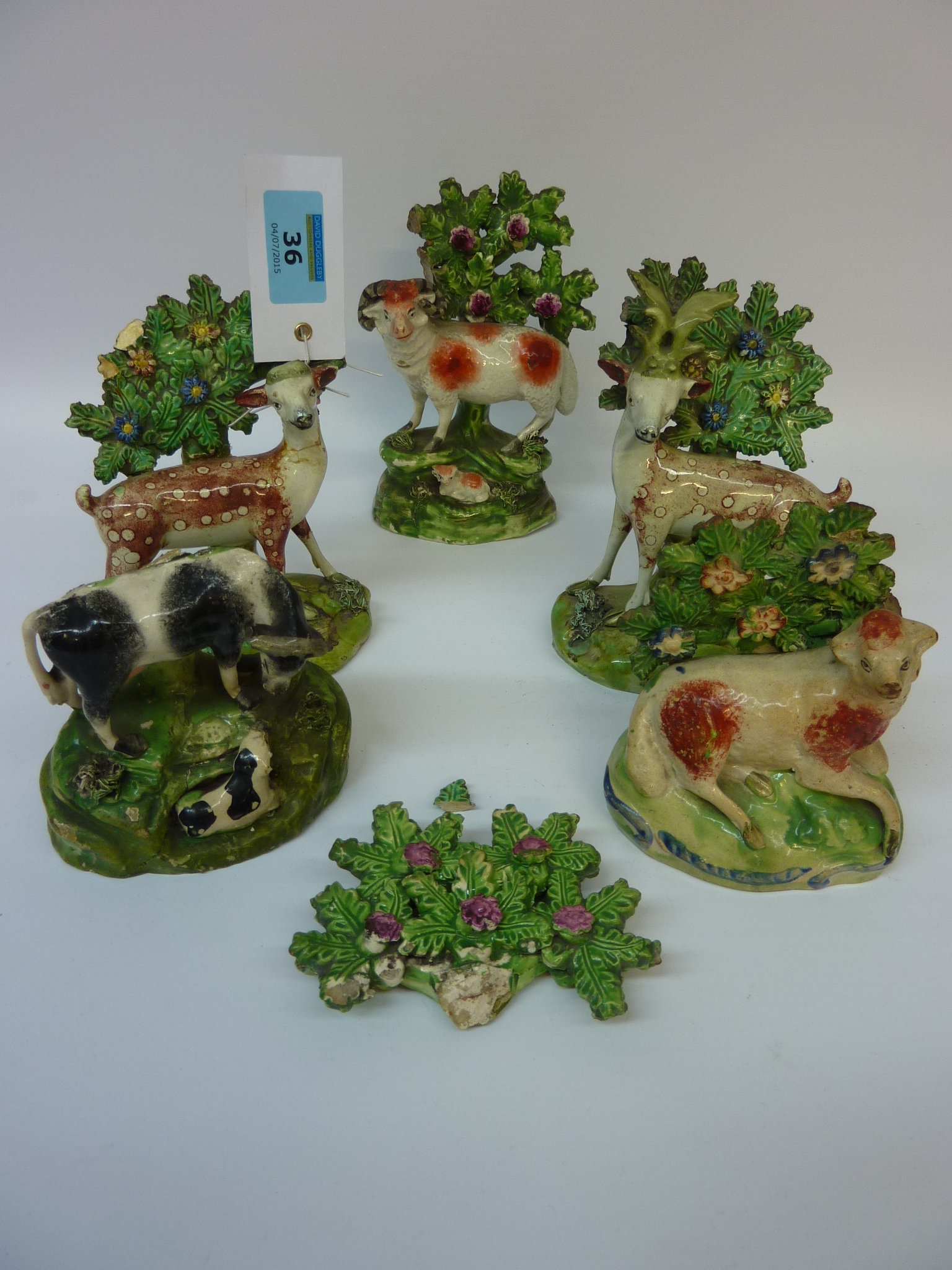 Pair early Victorian Staffordshire figures of deer 16cm and three similar groups (5) Condition