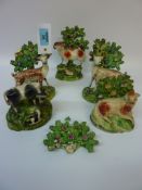 Pair early Victorian Staffordshire figures of deer 16cm and three similar groups (5) Condition