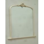 Arch top overmantle mirror in ivory frame with carved pediment,