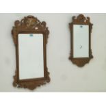 Reproduction walnut Chippendale style fret work mirror, with griffin motif (44cm x 75cm),