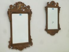 Reproduction walnut Chippendale style fret work mirror, with griffin motif (44cm x 75cm),