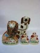 Victorian Staffordshire lion H19cm, Staffordshire spaniel with lustre decoration, and a pair of
