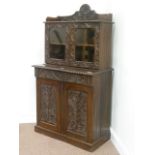 Late 19th century Colonial heavily carved oak bookcase on cupboard fitted with single drawer, W82cm,