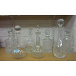 Four square cut crystal decanters and three others