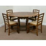 Oval oak drop leaf dining table and four matching ladder back chairs