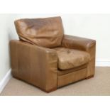Armchair upholstered in tan leather,