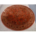 Persian design red ground circular rug,