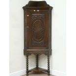 Victorian carved oak corner cupboard on turned bobbin stand,