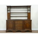 Early 19th century oak dresser fitted with three drawers enclosed by two arch panel doors;