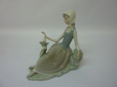 Lladro country girl with bird on a branch figurine