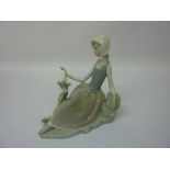 Lladro country girl with bird on a branch figurine