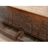 18th century heavily carved oak mule chest fitted with hinged top and two drawers to base, W146cm,