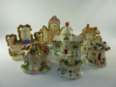 Two Victorian Staffordshire folly models H18cm and five other cottage models (7)