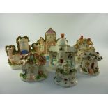 Two Victorian Staffordshire folly models H18cm and five other cottage models (7)