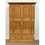 Waxed pine double wardrobe fitted with two drawers to the base, W135cm, H190cm,