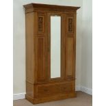 Edwardian satin walnut wardrobe fitted with mirror glazed door and single drawer to base,