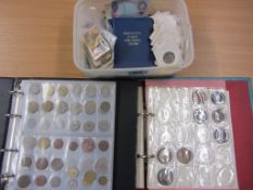 Two albums of coins and a box containing loose coins, notes,