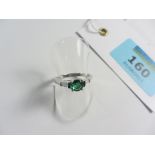 Platinum ring set with single emerald and baguette diamond shoulders stamped PT950