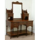 Late Victorian walnut dressing table fitted with five drawers,