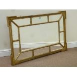 Late 19th/ early 20th century gilt framed wall mirror set with eleven bevelled glass panels,