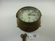German U Boat brass bulkhead clock, convex white enamel 15cm dial with arabic numerals,