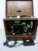 1950s electric Singer sewing machine with accessories