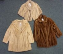 Fur capelet and two other fur coats