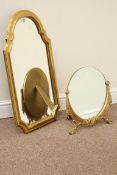 Wall mirror in shaped gilt frame and a small circular bevelled edge mirror (2)
