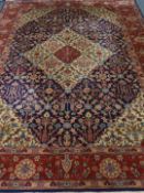 Large Persian Tabriz red and blue ground rug,