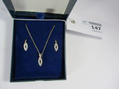 Diamond accent pendant on chain stamped 375 and matching pair ear-rings stamped 9ct